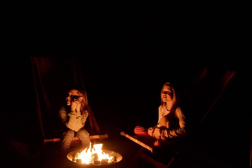 Enjoying campfire stories and the benefits of our propane fire bowl before bed. Photo: Home While We Roam