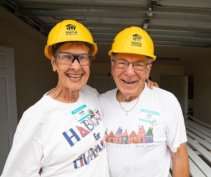 Linda and Carl Schmidt in yellow hard hats