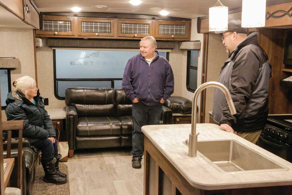 RV shoppers check out the interior of an RV
