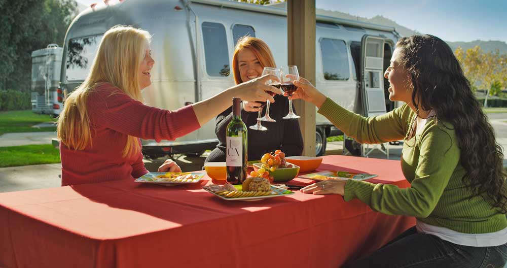 Friends raise their glasses in a toast at Pechanga RV Resort