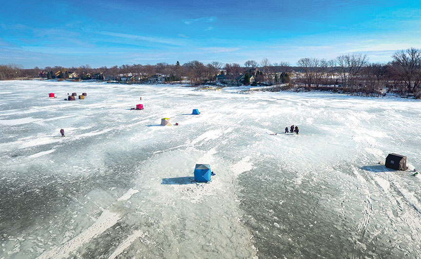 Aerial view of Green Bay with ice-fishing shanties on the frozen bay.