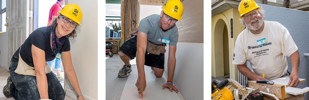 Three volunteers at work on a Habitat for Humanity build