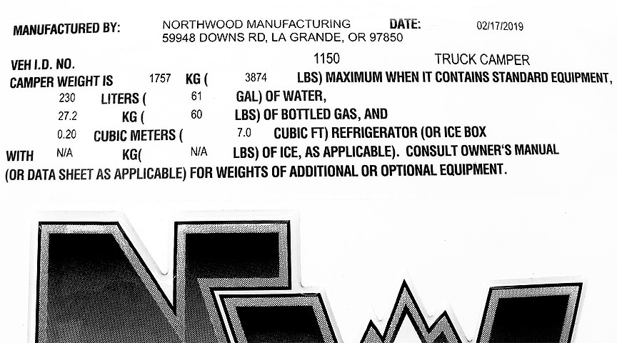 Decal showing truck camper weights and capacities.