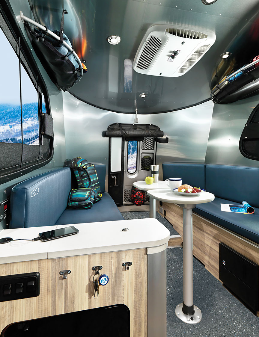 Interior of Basecamp showing aluminum walls and bench seating.