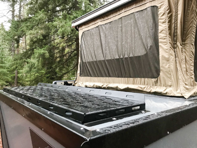 For transporting a cargo carrier or outdoor gear such as a canoe, kayaks or mountain bikes, the roof has steel racks in the front and rear.