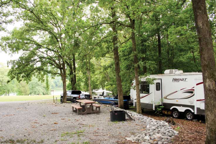 RVs parked in forest at Hillman Ferry Campground in Land Between the Lakes, Tennessee