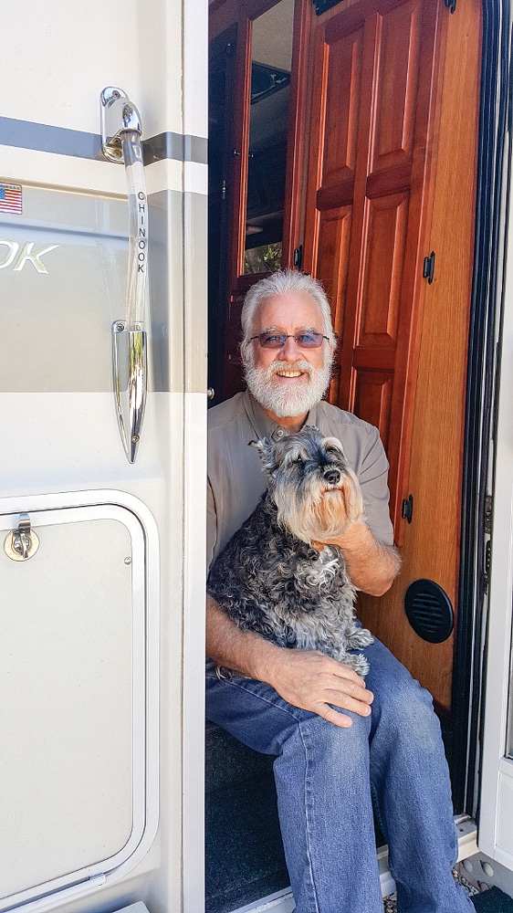 Jeff and Roxie, travel companions, sit in the Chinook’s rear entrance.