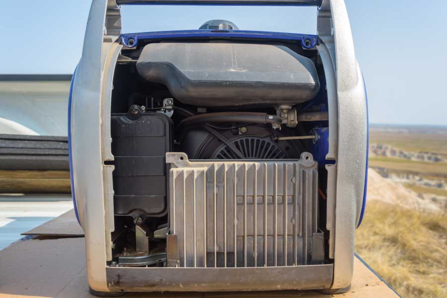 To access the air filter, unscrew and remove the side panel of the generator.