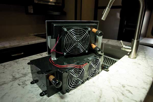 14) An 8,200-Btu Cozy heat-exchange unit is shown here on the bottom, with a smaller 4,000-Btu Whisper heat-exchange unit on top.
