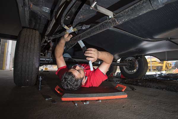 (16) then the tubing is routed underneath the trailer.