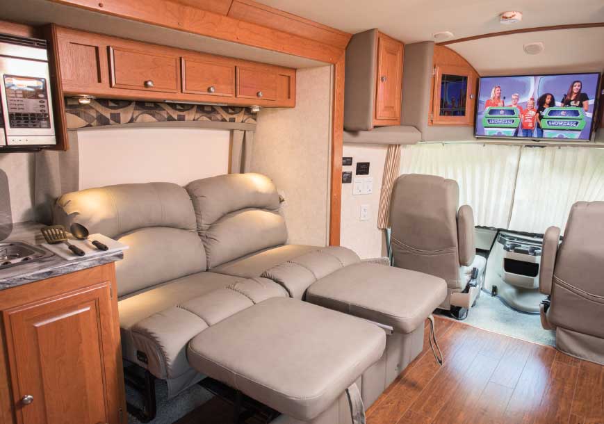 The couch is comfortable for lounging, but requires neck turning to watch the forward-mounted TV. Slideout opens living area nicely, and future models will have leather upholstery.