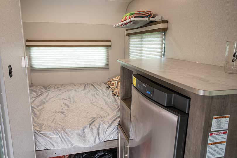 Photo of No-Boundaries NB16.5 travel trailer roomy three-way silent-absorption refrigerator and queen-size bed in the rear
