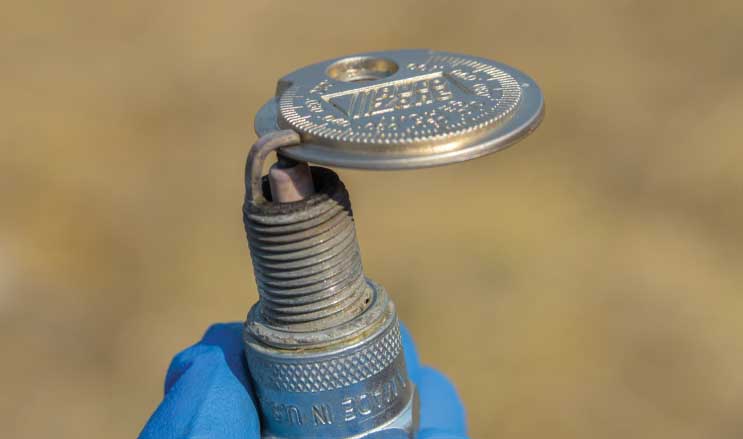 Use a feeler gauge to measure the spark-plug gap. If it is larger than the maximum gap noted in the owner’s manual, the spark plug must be replaced.