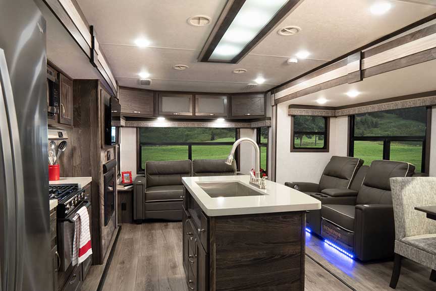 Looking toward back couch and window in Open Range 322RLS travel trailer