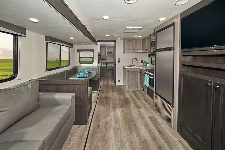 Living area and kitchen of 2021 Starcraft Super Lite 281BH travel trailer