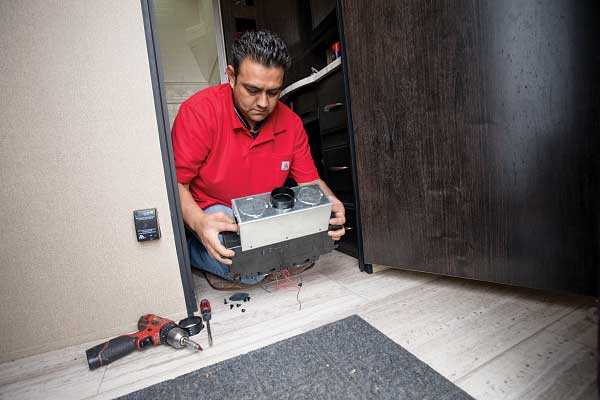 20) A Cozy heat exchanger is installed beneath the bathroom sink using a plenum.
