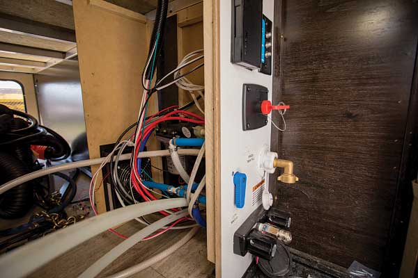27-28) The Whisper unit installed in the front storage compartment will heat the utilities.