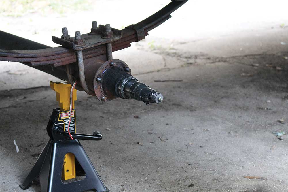 The brake wires on the right side of the trailer are routed through the axle tubes. 