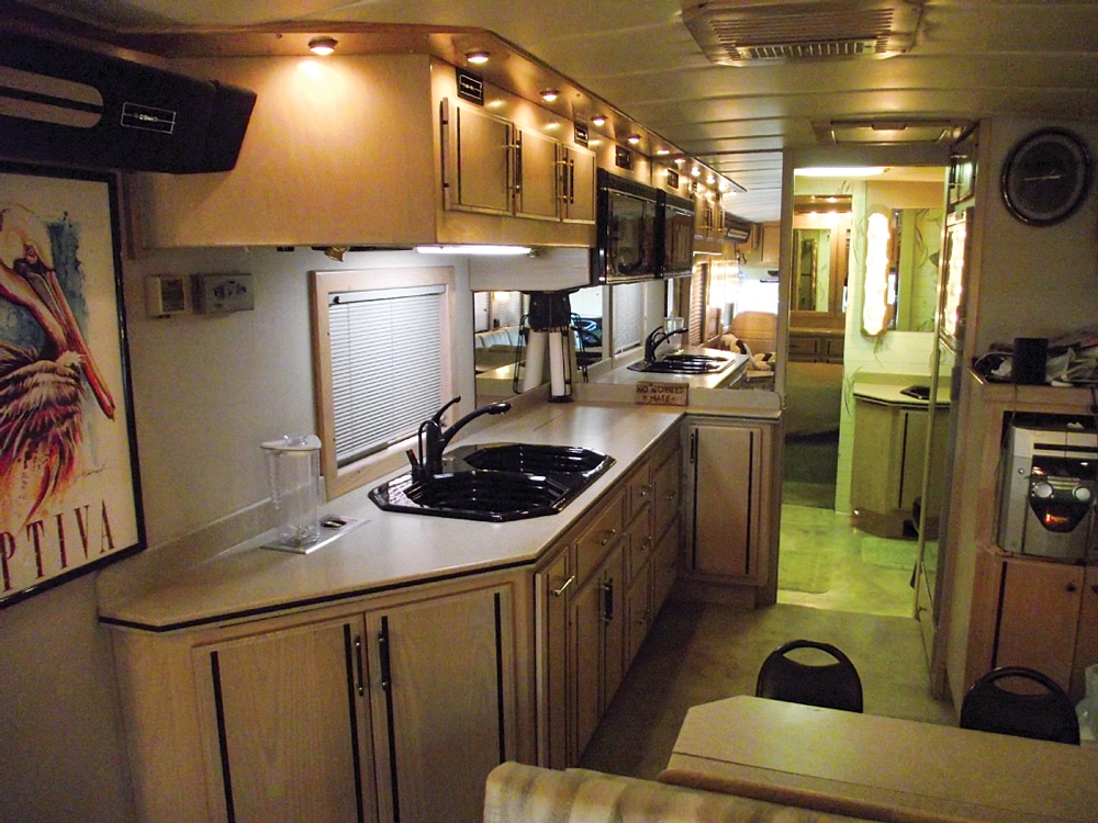 The galley features solid-surface countertops complete with a built-in blender. 