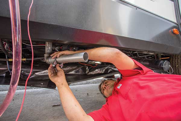 33) The exhaust pipe is connected to the unit through the hole cut in the floor.