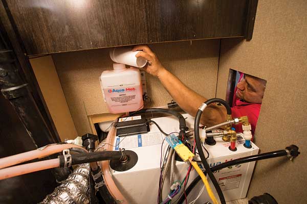38) Antifreeze is topped off through the old furnace entry point.