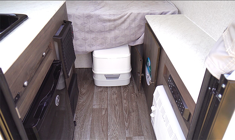 View inside showing the slide-in portable toilet.