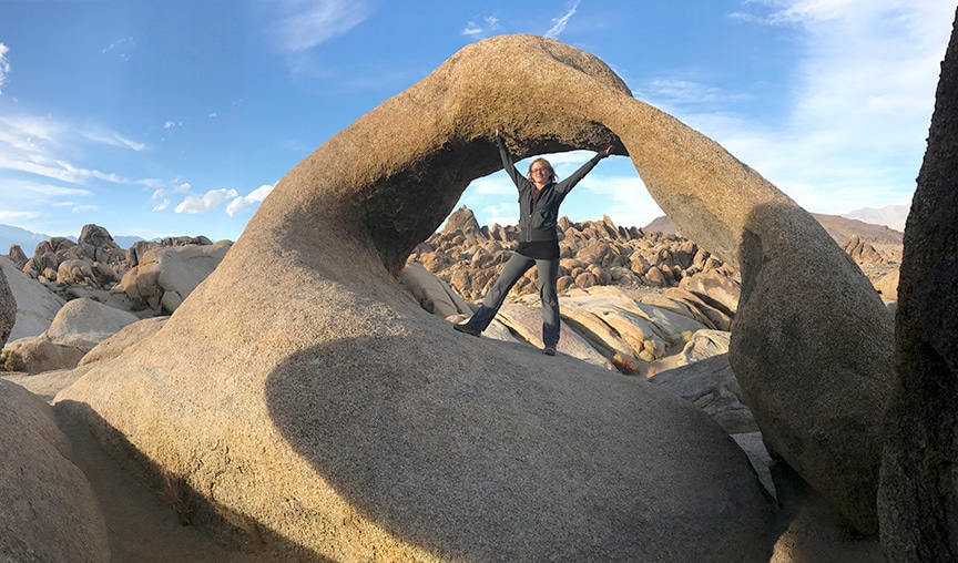 Cate Battles standing under Mobius Arch