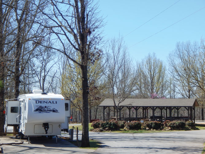 RV parked at Royston's Victoria Bryant State Park with covered picnic area with trees RV parked at Royston's Victoria Bryant State Park with covered picnic area with trees