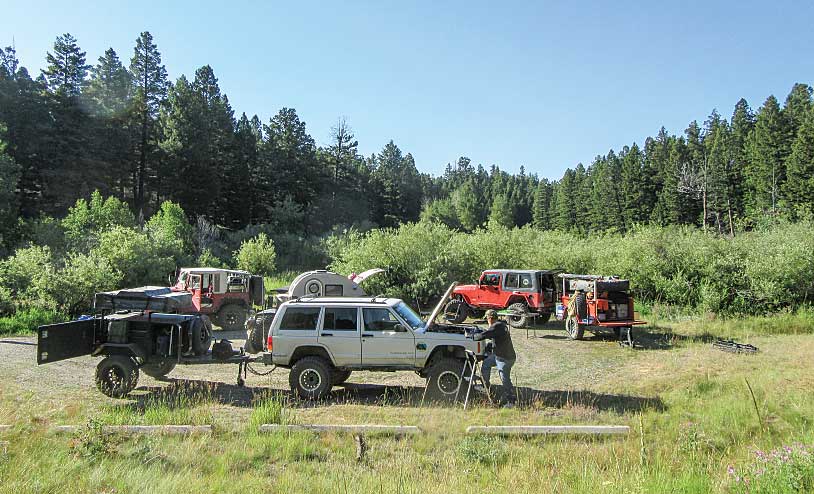 Jeeps and backcountry trailers in Montana camp