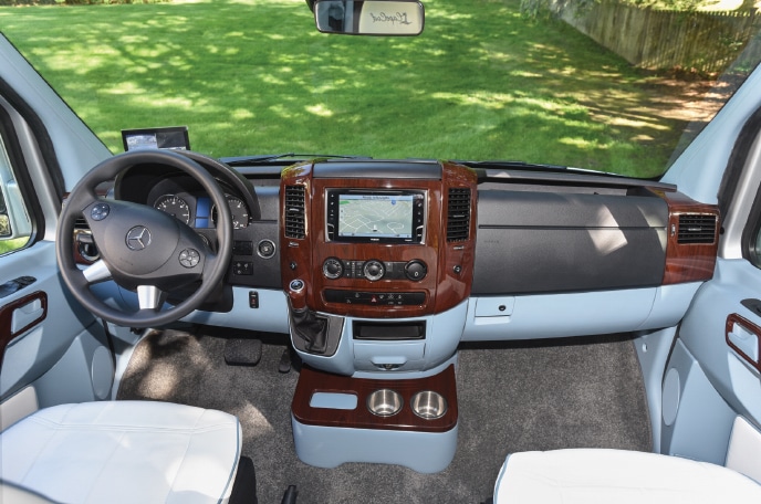 The driver's compartment is luxurious and comfortable. Note the matching painted panels.