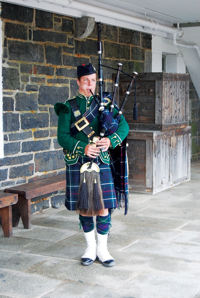 A 78th Highlanders re-enactor plays the bagpipes at the Halifax Citadel.