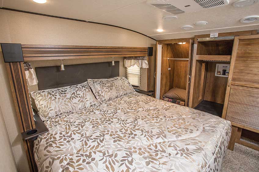 Spacious hanging wardrobes, a cabinet with washer-dryer hookups and an optional king-size bed in a slideout grace the Chaparral 381RD’s bedroom. 