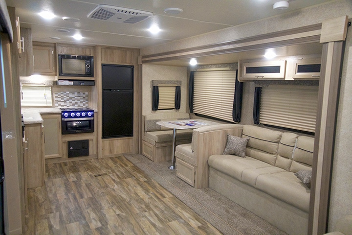 Living area of Catalina Legacy with couch, dinette and kitchen appliances.