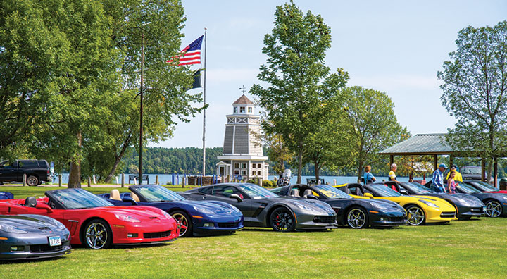 Corvettes parked on shoreline of Leech Lake in Walker, Minnesota