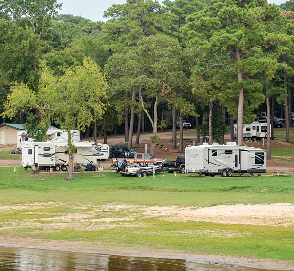 CRVs and trees at Cypres Bend RV Park in Many, Louisiana