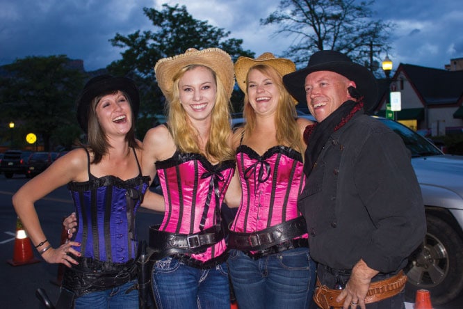 Dance-hall girls and the sheriff pose for photos after the Old West show at the Diamond Belle Saloon in the Strater Hotel.