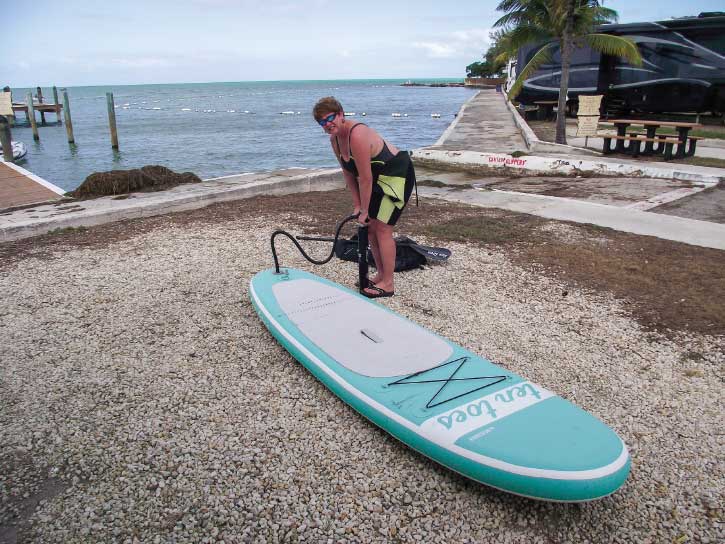 Inflating a board (here at a campground overlooking the Gulf of Mexico) takes about 10 minutes with a hand pump.