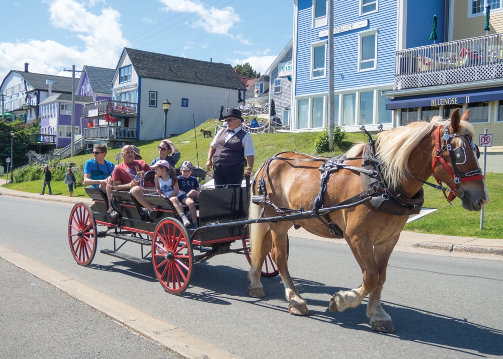 In Lunenburg, tourists see the sights in a horse-drawn wagon.