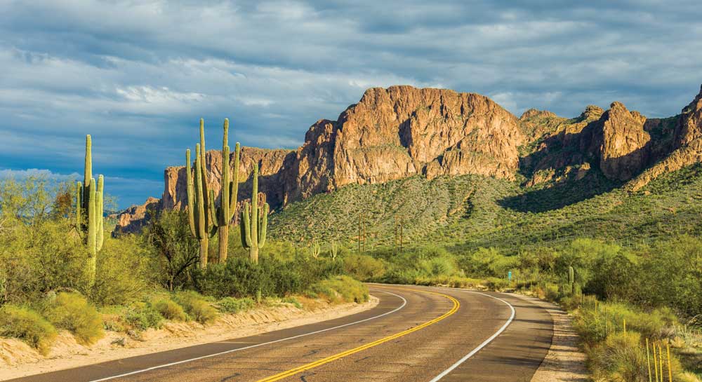 Photo of a road with rock formation in the distance to illustrate the photographic technique of scale