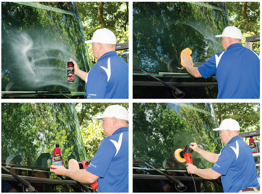 Man cleaning motorhome windshield