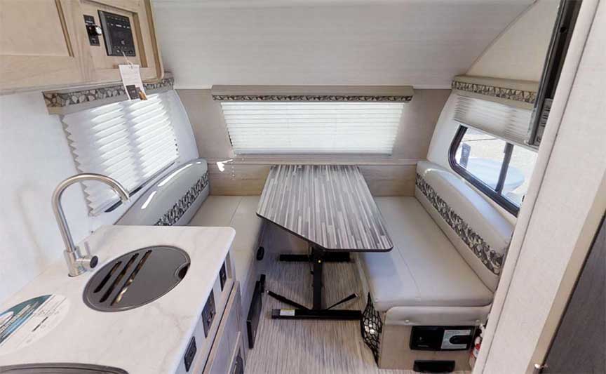 Dinette with bench seats in Rpod 171 travel trailer.