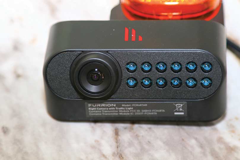 a close-up of the right marker-light camera lens and infrared LED array for night vision.