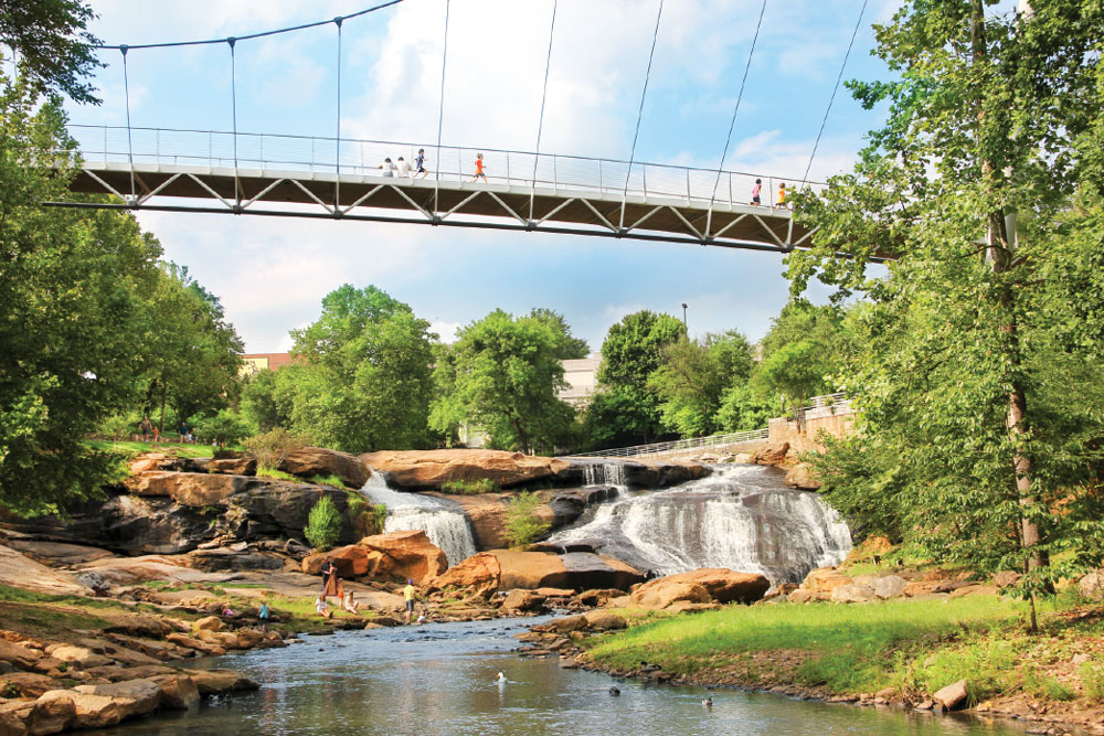 In Greenville, Falls Park on the Reedy welcomes the public to enjoy nature, trails, outdoor art and the waterfall view from Liberty Bridge.