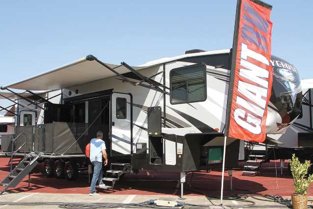 Cyclone 4270 RV with man walking up stairs