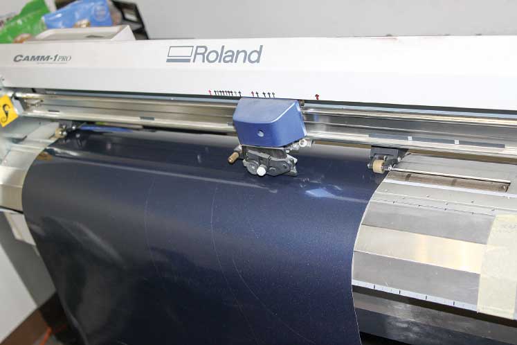 Once an entire roll of vinyl is loaded into the cutting machine, all the new pieces for individual colors are produced. This is a precise process that has no room for errors.