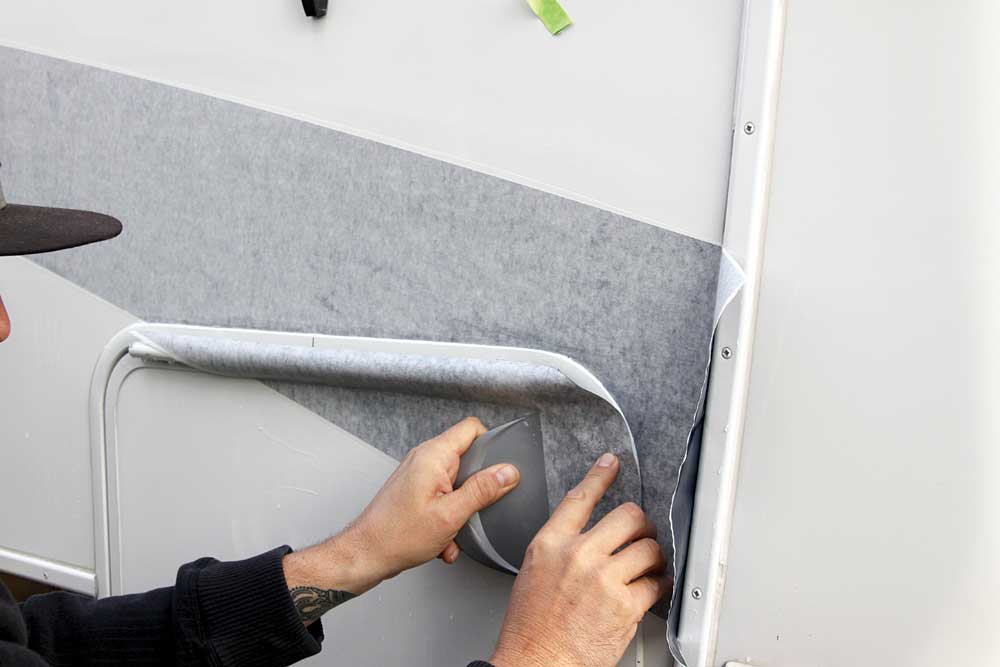 A special tool is used to fit the new vinyl into curves and moldings. This also takes many years of experience to do it right.
