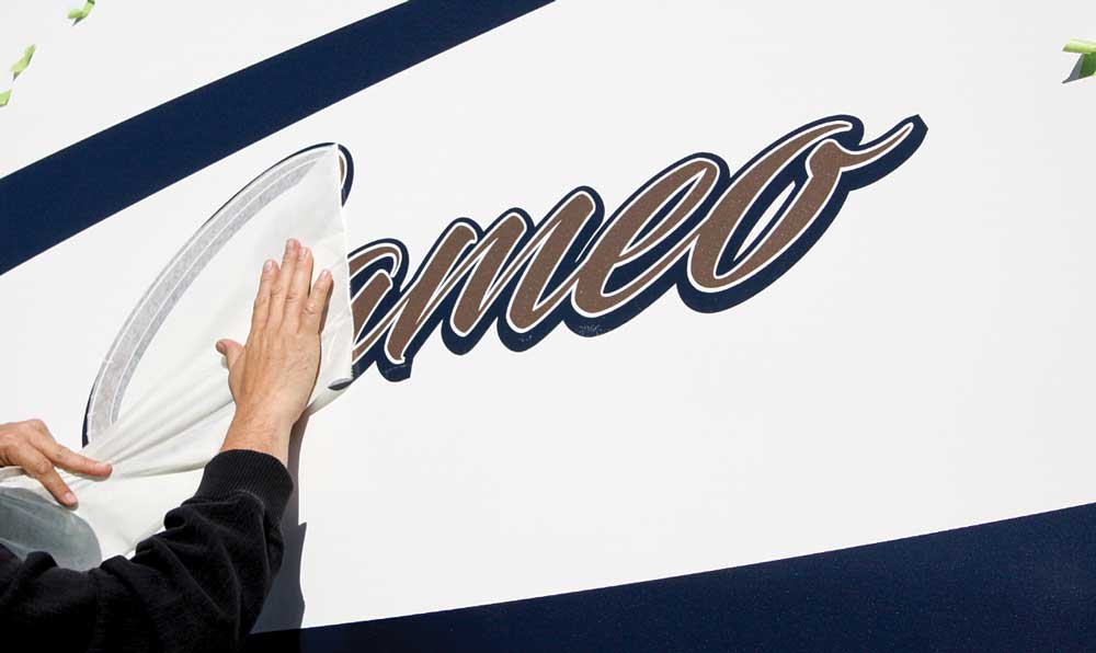 Placing new vinyl graphics is not for the faint of heart. This process is long and detailed, but the results will add many years to the look of any RV.
