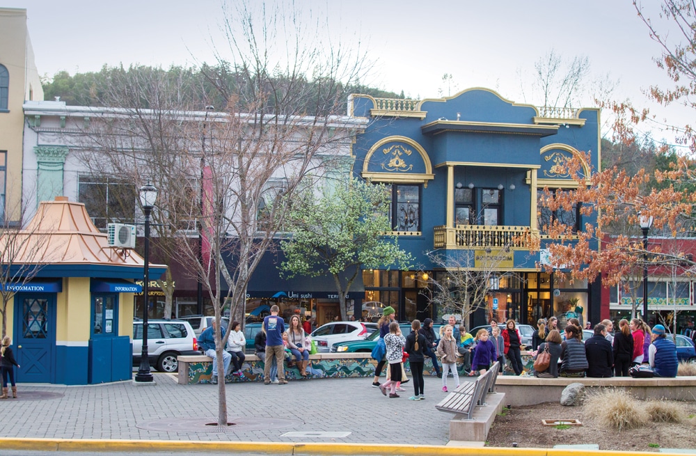 Residents and visitors alike gather in a downtown Ashland square. 