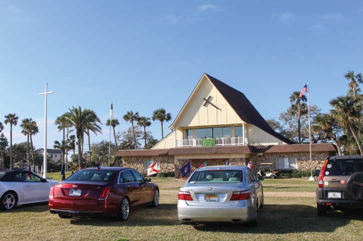 Cars are shown at Daytona Beach Drive-In Christian Church which welcomes visitors to Sunday service on the grounds of a former drive-in movie theater. 