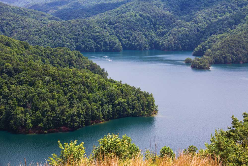 Secluded Lake Jocassee is noted for its clear, cold waters, fine mountain views, and for its fishing and water activities.